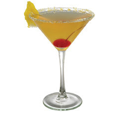 A golden orange cocktail is served in a martini glass with a sugar rim and garnished with a lemon wedge and a red cherry inside the drink