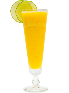 A bright yellow-orange drink is served in a tall stemmed glass and garnished with two lime slices on the rim.