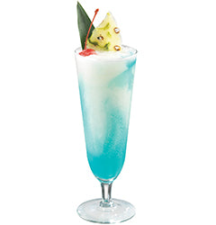 A bright turquoise-blue cocktail with ice is served in a tall stemmed glass and garnished with a pineapple wedge, a red cherry, and a green leaf.