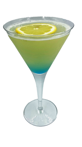 Martini glass with layered green and blue drink lemon wheel plain background