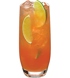 Orange cocktail with ice and lime slices in a tall glass isolated on white background