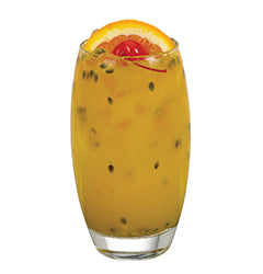 A bright yellow passion fruit cocktail is served in a tall glass with passion fruit seeds visible throughout and garnished with an orange slice and red cherry on top.