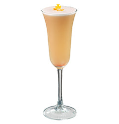 Champagne flute with tan drink yellow flower plain background