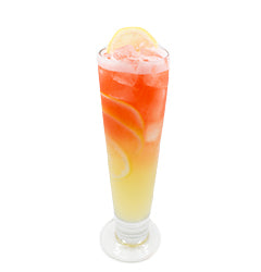 Pilsner glass with layered red yellow iced drink lemon wheel plain background