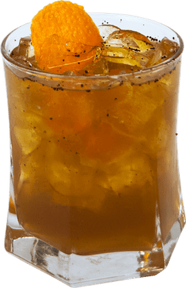 An amber cocktail with ice and orange peel is served in a short glass and topped with a large orange garnish.