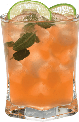 A pale peach-colored cocktail with ice is served in a short glass with fresh mint leaves inside and two lime slices on the rim.