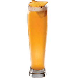 A bright orange cocktail is served in a tall narrow glass with ice and a pineapple slice garnish on top.