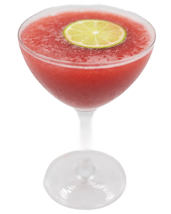 A bright red frozen cocktail is served in a coupe glass with a lime slice floating on the surface.