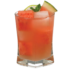 A red watermelon cocktail with ice is served in a short glass with watermelon pieces inside and garnished with a watermelon wedge and fresh mint leaves