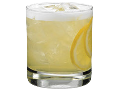 A pale yellow cocktail with ice and a foamy top is served in a short glass with lemon slices visible inside and along the side