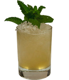 A pale golden cocktail with crushed ice is served in a short glass and topped with a generous bunch of fresh mint leaves.