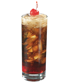 A dark brown cocktail with ice and pineapple pieces is served in a tall narrow glass, topped with a light foamy layer and garnished with two red cherries