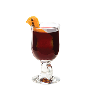 Irish coffee glass with dark red drink orange peel with cloves plain background