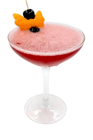 Coupe glass with red drink orange peel cherry plain background