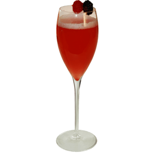 A bright red cocktail with a light foamy top is served in a tall champagne flute and garnished with red and dark berries on top.