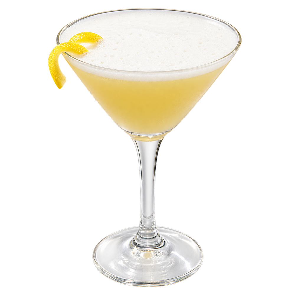 A pale yellow cocktail is served in a coupe glass with a thick white foamy top and garnished with a curled lemon peel on the rim.