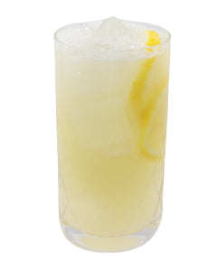 A pale yellow cocktail with ice is served in a tall glass with a long lemon peel visible inside and a small lemon garnish near the rim.