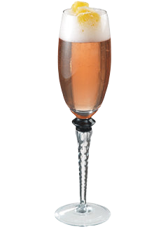 An amber cocktail with a white foamy top is served in a tall stemmed glass and garnished with a lemon peel on top