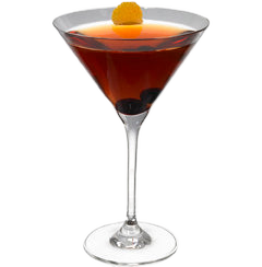 A dark red cocktail is served in a martini glass with a cherry inside and a small orange garnish on top