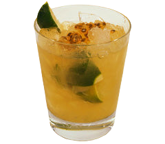 A yellow orange cocktail with ice is served in a short glass with lime pieces inside and passion fruit seeds on top with a lime wedge garnish