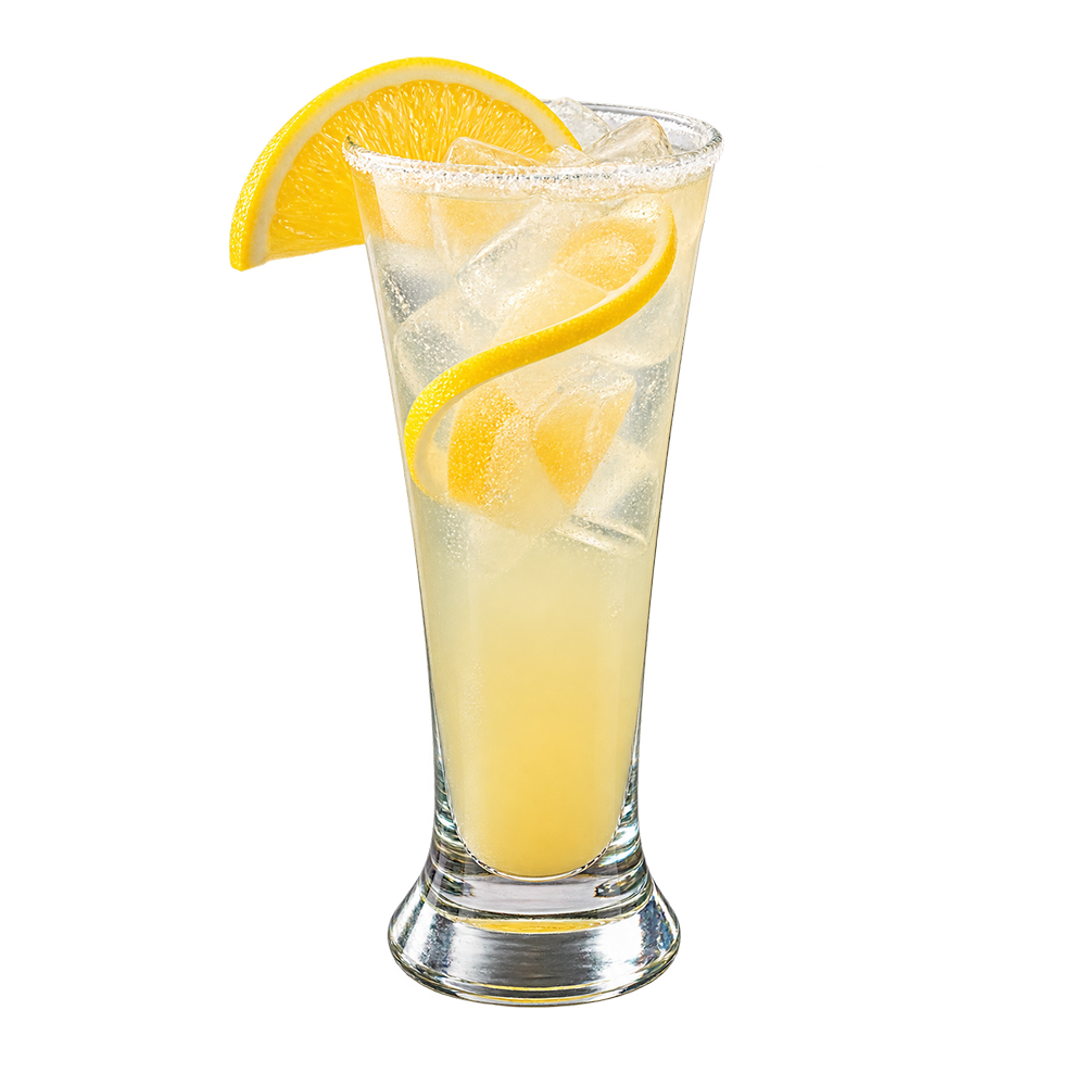 A pale yellow lemon cocktail with ice is served in a tall glass with lemon slices visible inside and a large lemon wedge on the rim
