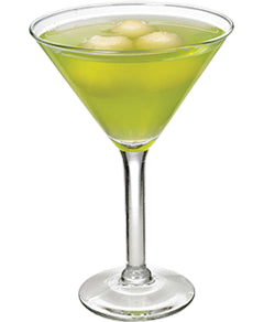 A bright green cocktail with ice is served in a martini glass with a clear stem and base