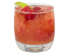 A red raspberry drink with ice and visible raspberry pieces is served in a short glass and garnished with raspberries and a lime wedge.
