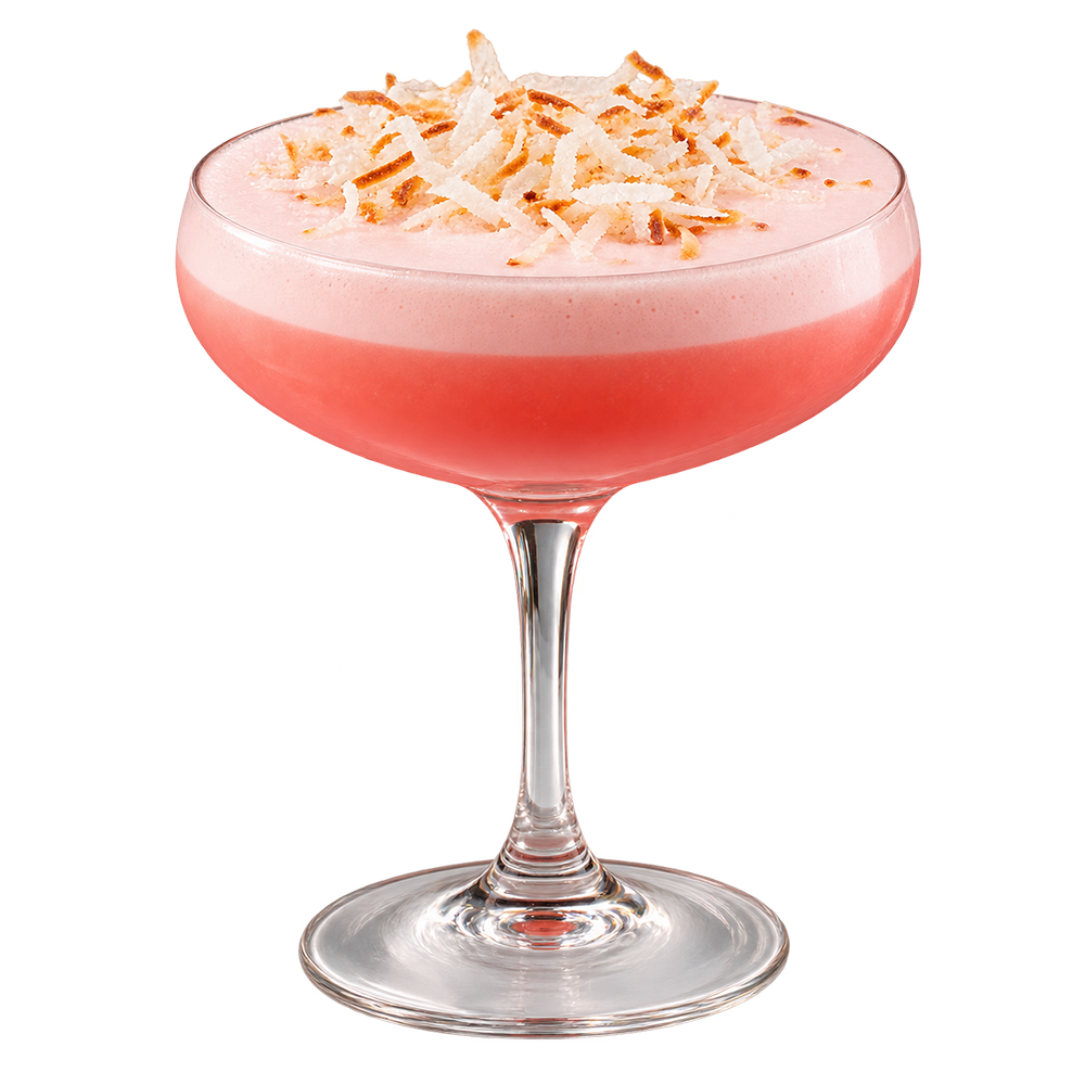 Coupe glass with creamy pink drink white chocolate shavings plain background