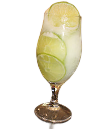 Goblet glass with white slush drink lime wheels bar background