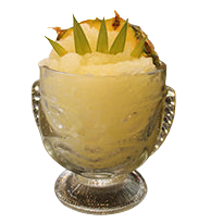 Tiki glass with yellow slush drink pineapple wedge leaves bar background